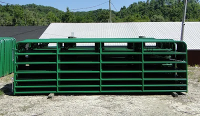 Green-painted 7-bar tubular steel farm gate by Heritage Gate Company