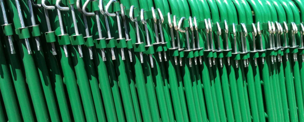 Close-up of green-painted panel connectors and latch hooks